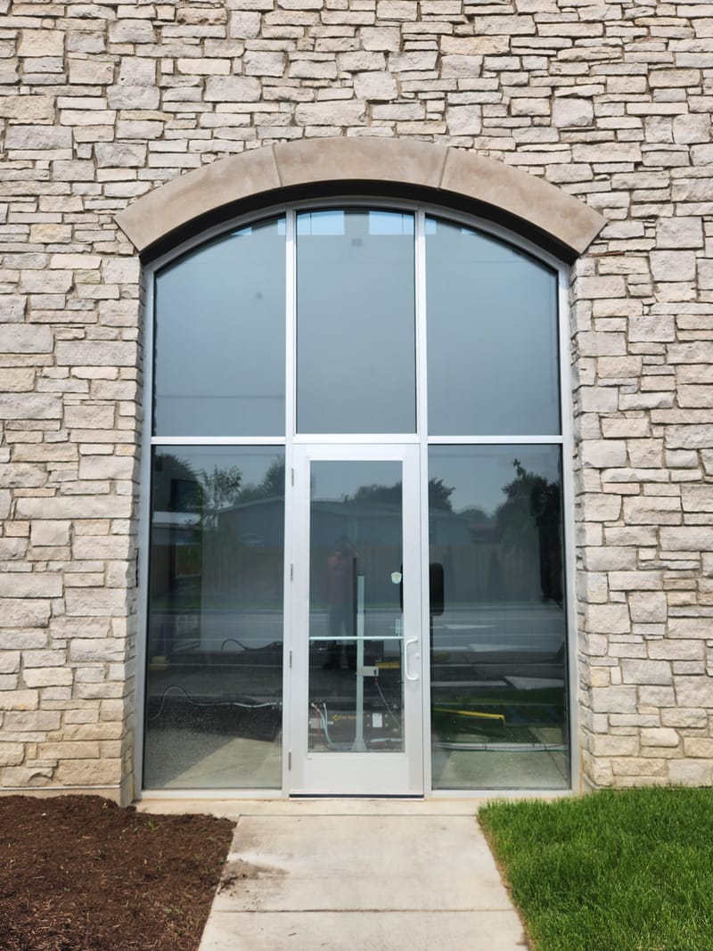 Clear Anodized aluminum and glass entrance with sidelites and an arched transom - Toledo, OH