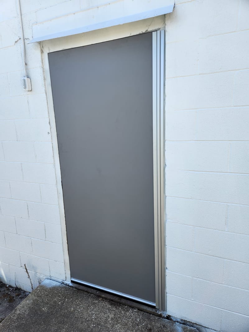 Flush exterior hollow metal door with a continuous hinge in a block wall - Sandusky, OH