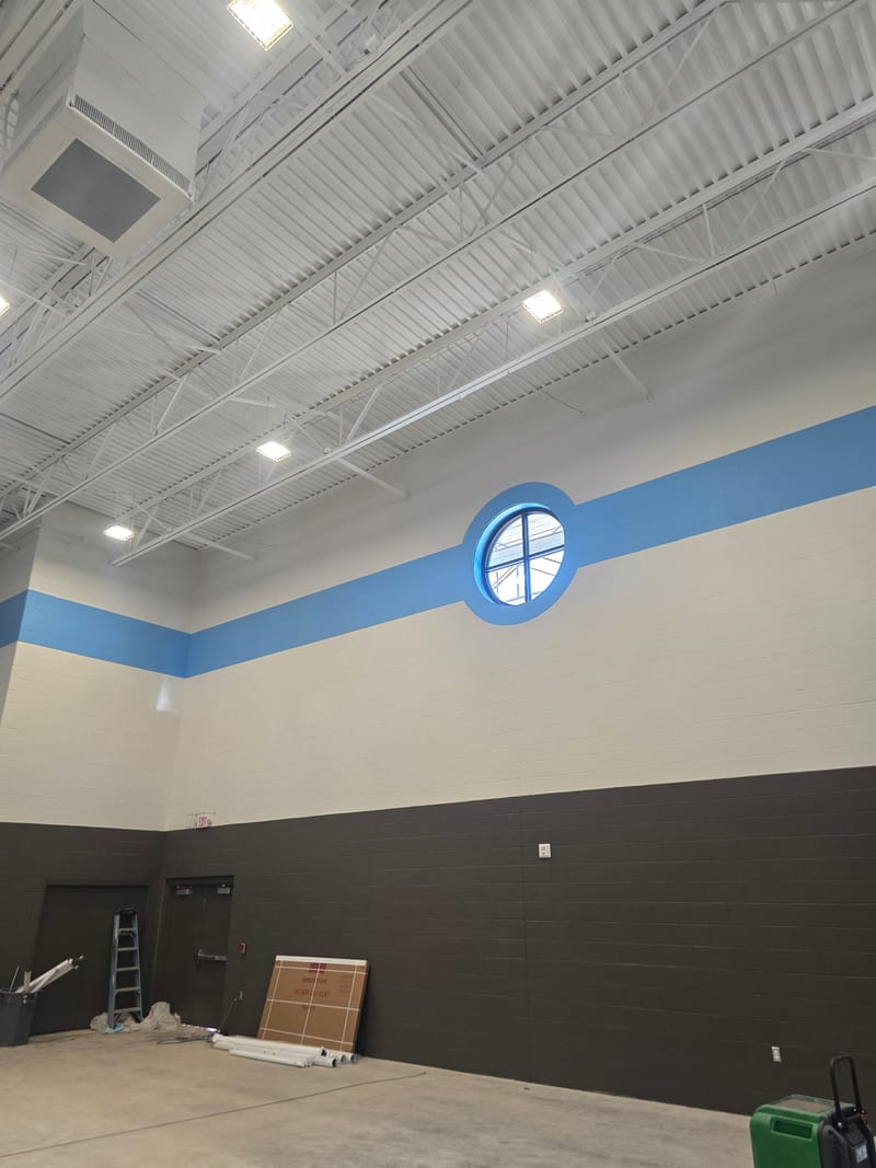 Round storefront window in a gymnasium wall - Lakewood, OH