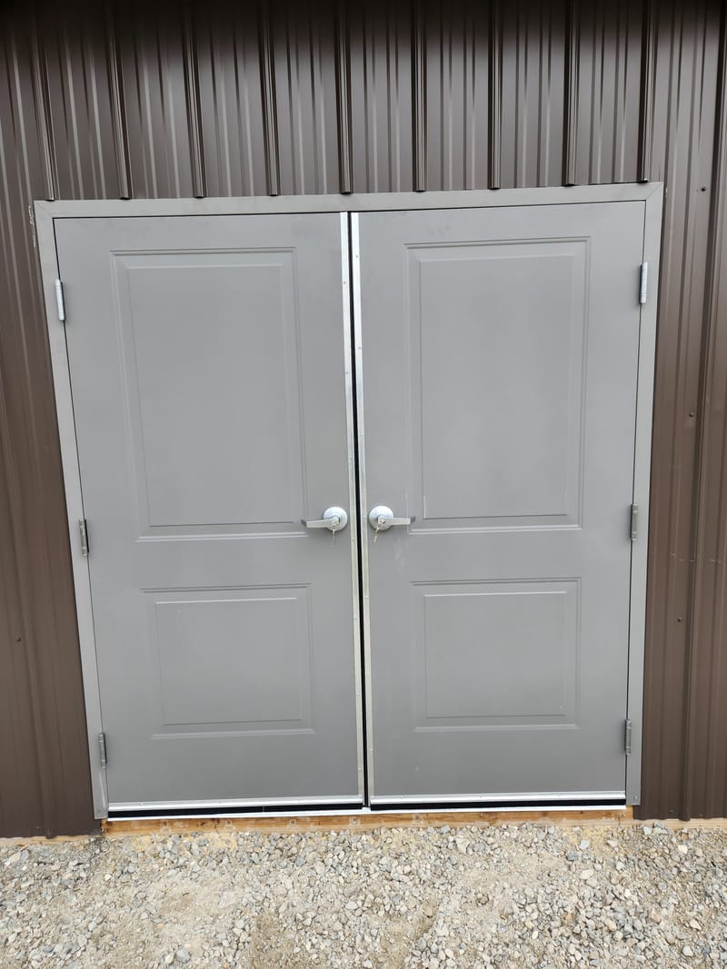 Embossed hollow metal double doors with lever locks and door sweeps - Oak Harbor, OH
