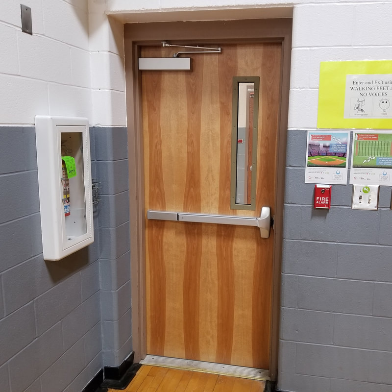 Wood door with an exit device and overhead closer - Huron, OH