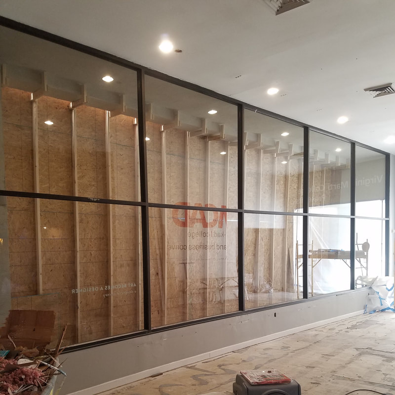 Interior aluminum storefront framing and glass panels - Columbus, OH