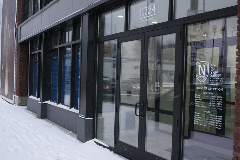 Aluminum storefront entrance with glazed transoms - Columbus, OH